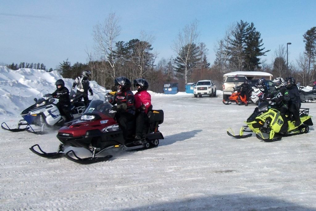 Snowmobilers get ready to head out in Espanola.