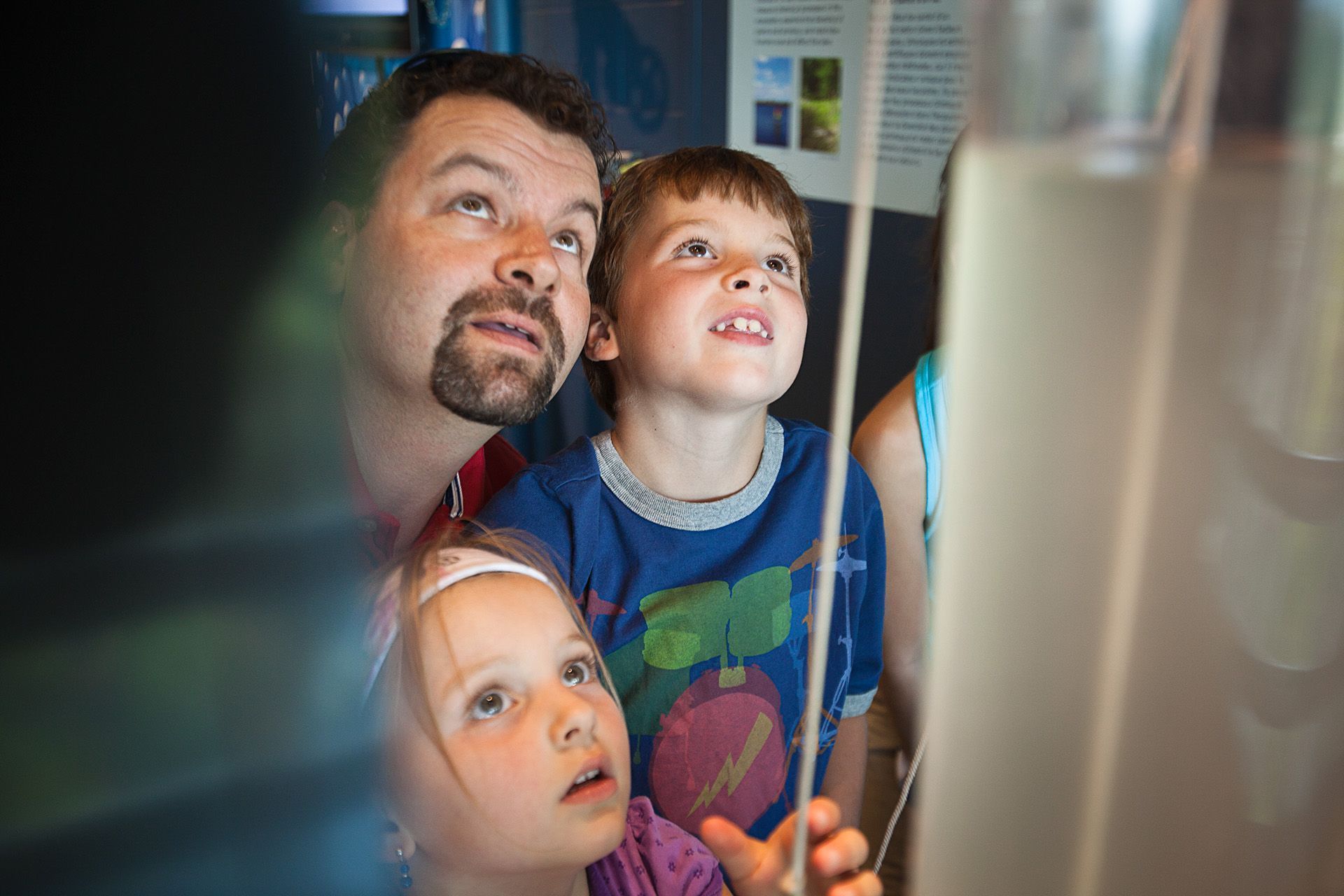 A family looking at an exhibit at Sudbury Science North.